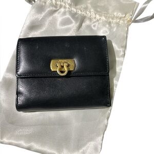 Authentic Ferragamo black leather trifold wallet gold with callouts